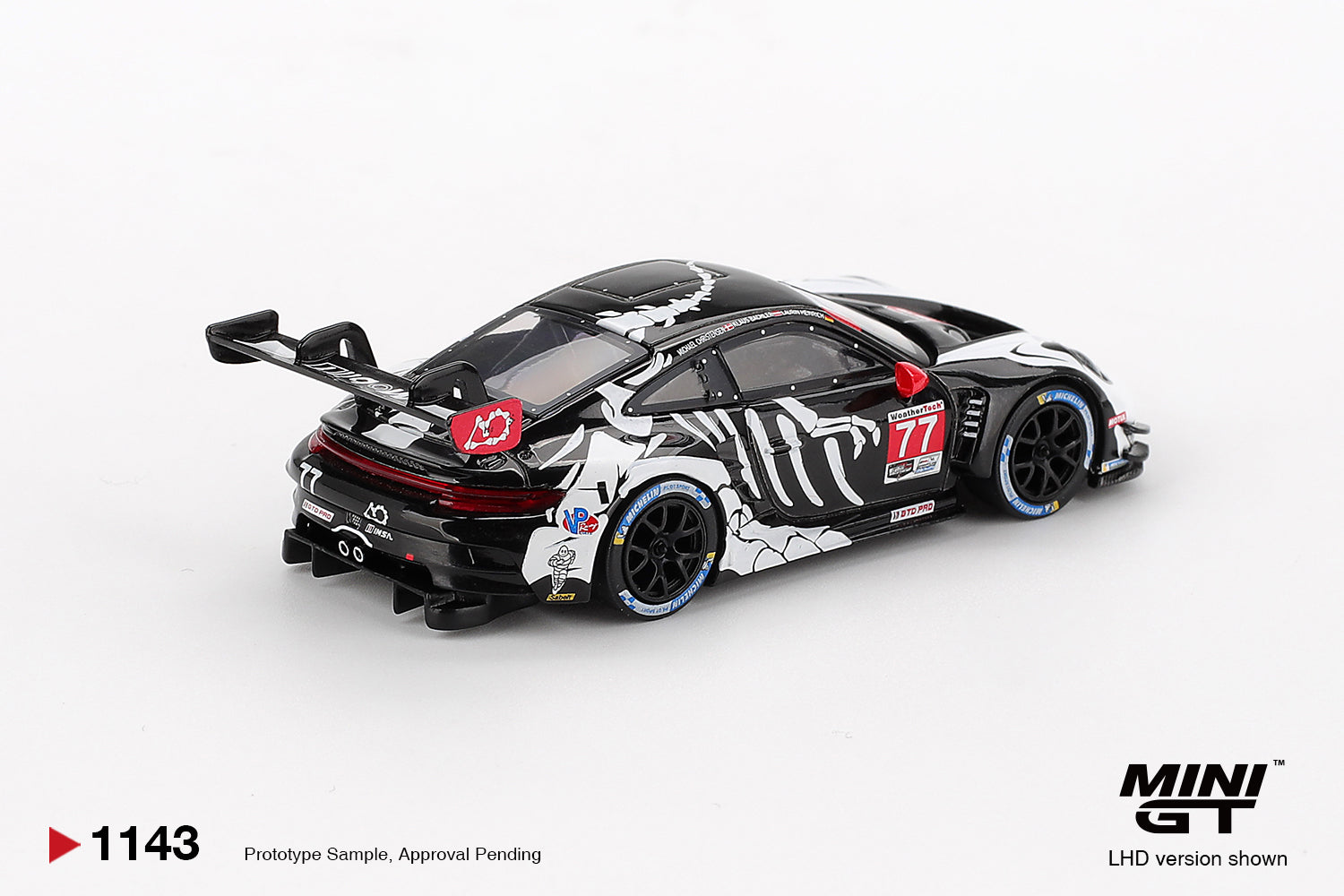 Mini GT 1:64 Porsche 911 GT3 R #77 AO Racing "Skeleton Rexy" IMSA 2025 Petit Le Mans